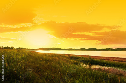 Picturesque view of beautiful lake at sunset