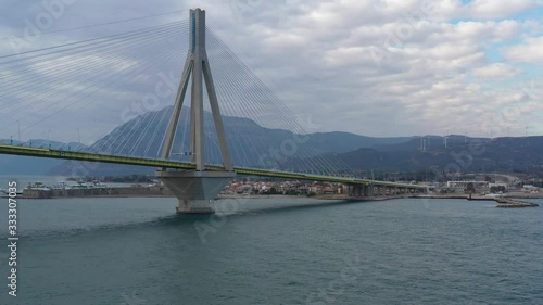 Wallpaper Mural Aerial view of long cable-stayed Rio bridge in Greece at clouds weather, Ferry station Torontodigital.ca