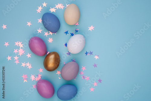 Colorful Easter eggs over blue background