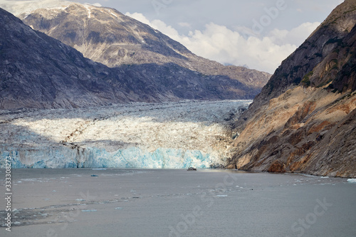Dawes Glacier in Endicott Arm near Juneau Alaska. Rugged Mountains in the background. 