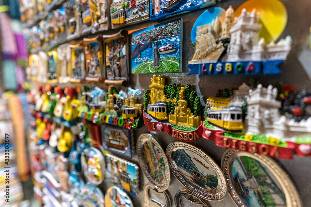 Patterns and symbols of portuguese cities on souvenir magnets of street market