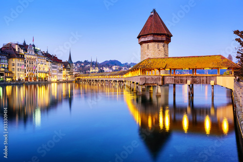 Chapel bridge in Lucerne city, Switzerland, on a blue evening