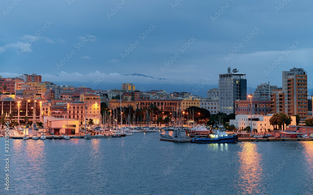 Port with ships at Cagliari at dusk