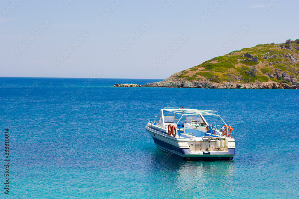 Boat in blue sea on a coastline
