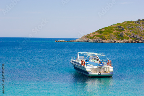 Boat in blue sea on a coastline