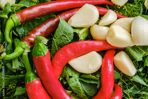 hot peppers and garlic on g...