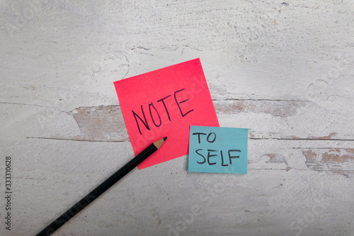 Photography note to self message on post notes white wooden background