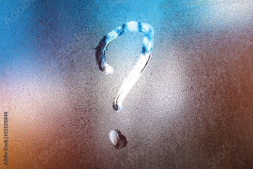 weather forecast - question mark on misted glass. inscription on the sweaty glass. question about everything, searching meaning of life.