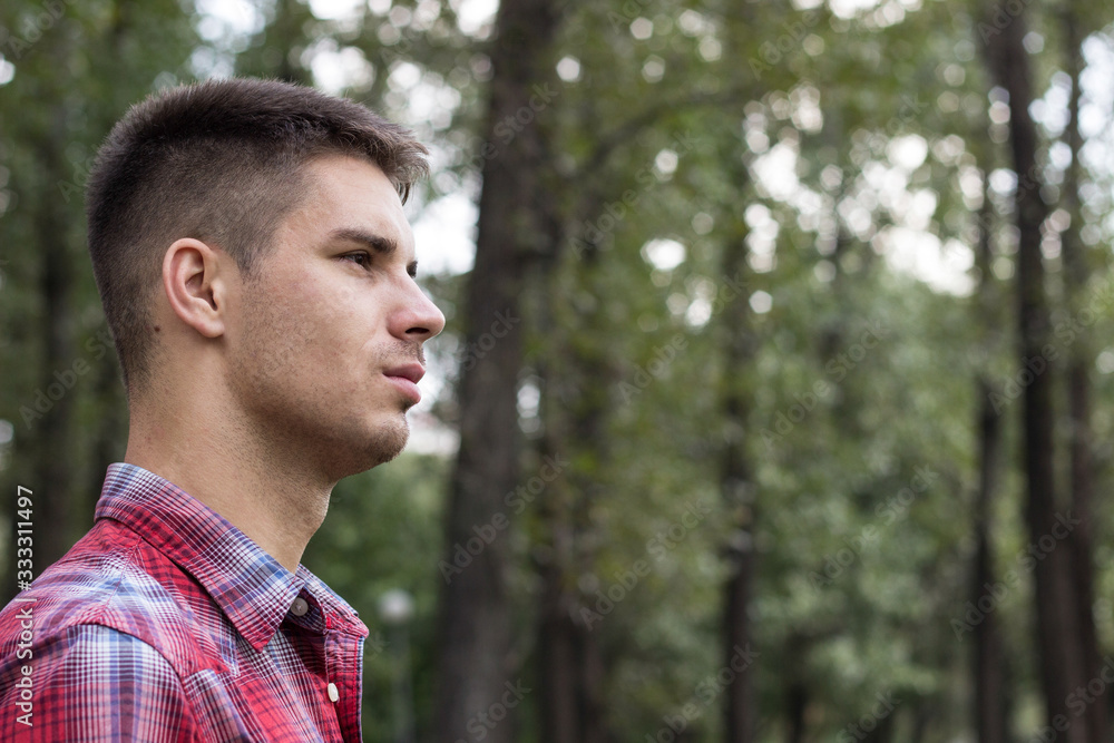 Thoughtful young male, nature and physical exercise concept Thoughtful young male, nature and physical exercise concept