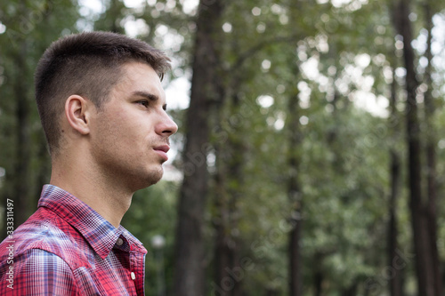 Thoughtful young male, nature and physical exercise concept