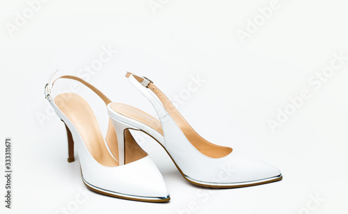 Fashionable women shoes isolated on white background. Stylish classic women leather shoe. White high heel women shoes on white background