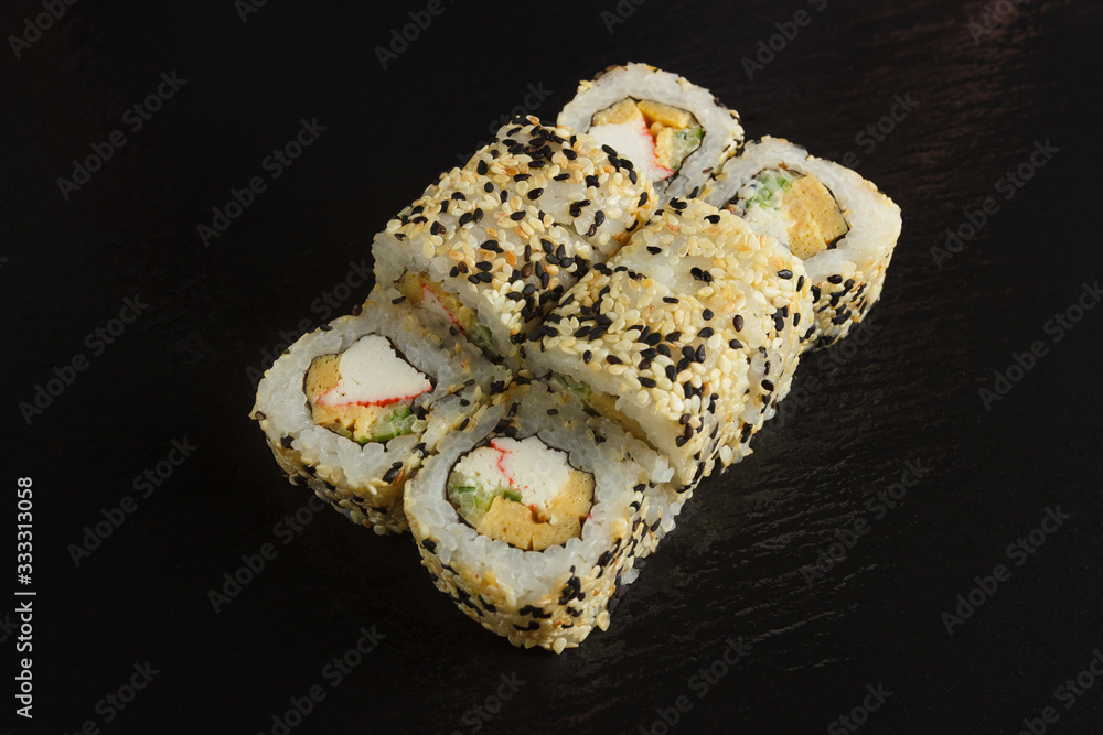 Japanese food: Set of salmon sushi and rolls with salmon and eel Japanese food: Set of salmon sushi and rolls with salmon and eel