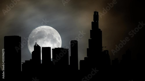 Bogota: Time Lapse by Night with Full Moon and Skyscrapers in Silhouette, Bogotà Distrito Capital, Colombia photo