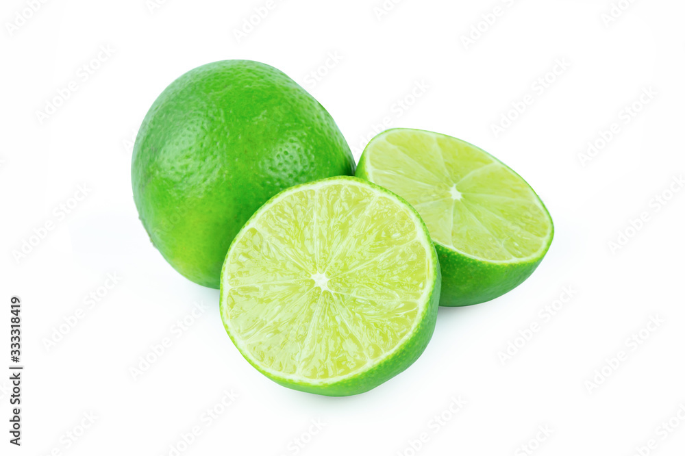 Lime with slices half isolated on white background. Green citrus fruit. with clipping path Lime with slices half isolated on white background. Green citrus fruit. with clipping path