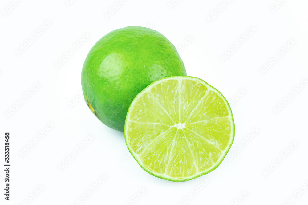 Lime with slices half isolated on white background. Green citrus fruit. with clipping path Lime with slices half isolated on white background. Green citrus fruit. with clipping path