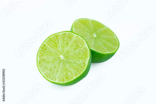 Lime with slices half isolated on white background. Green citrus fruit. with clipping path © Achira22