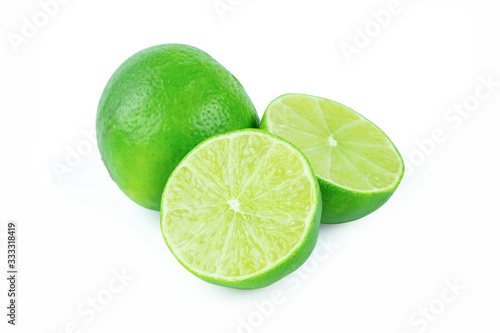 Lime with slices half isolated on white background. Green citrus fruit. with clipping path