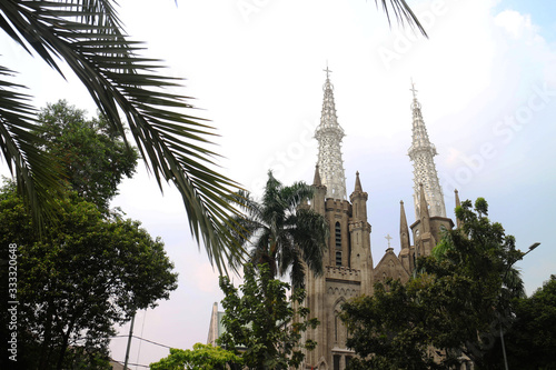 Jakarta Katredal Church is a place of worship for Christians, opposite the Istiqlal Mosque - view from Istiqlal Mosque photo