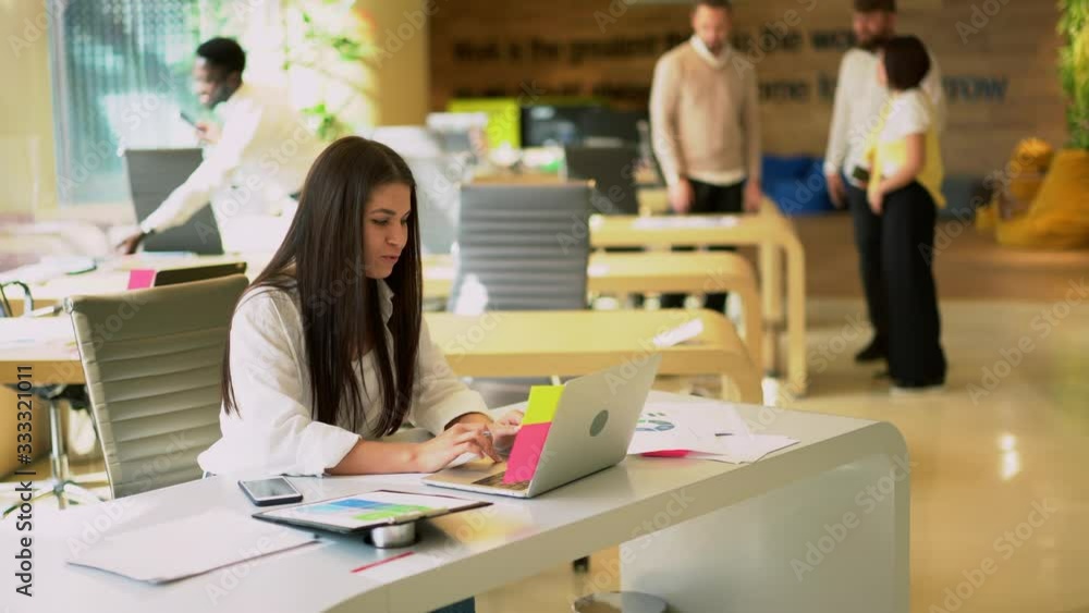 Caucasian woman programming laptop code during distance job in modern coworking space for freelancers, skilled woman browsing communication service during networking on netbook technology
