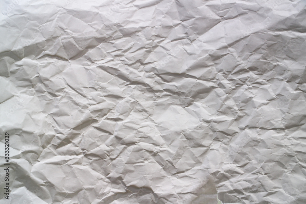 Fototapeta premium white paper crushed by hand squeeze, for wallpaper, added text
