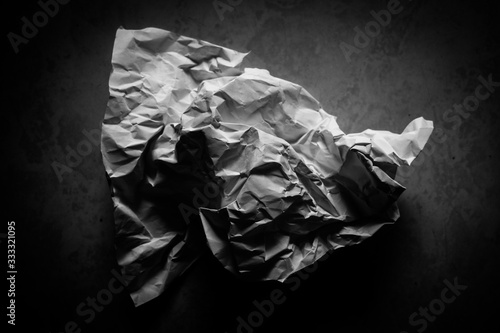 Black and white paper crushed by hand squeeze, for wallpaper, added text