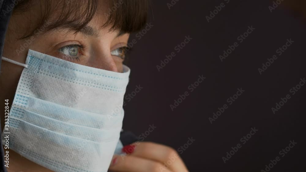 Portrait of a young woman wearing protective mask . Concept of health and safety life, coronavirus, virus protection, pandemic Portrait of a young woman wearing protective mask . Concept of health and safety life, coronavirus, virus protection, pandemic