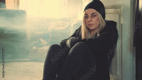 Addict woman feeling breaking in an abandoned house. Drug use, addiction, social degradation and self-destruction concept