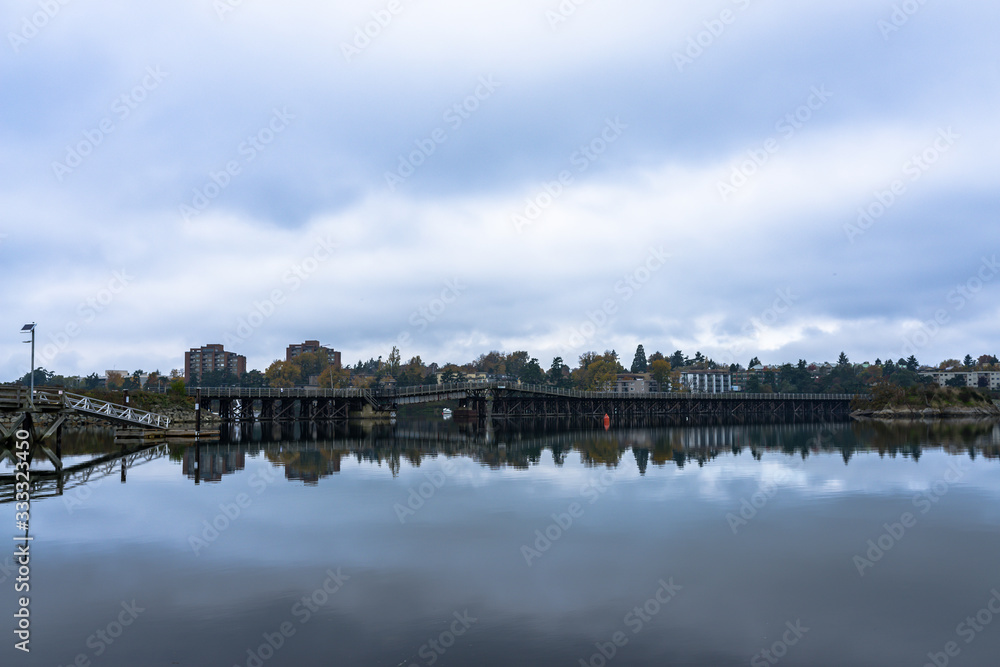 Reflections of the Selkirk Trestle Bridge in Victoria on Water Like Glass