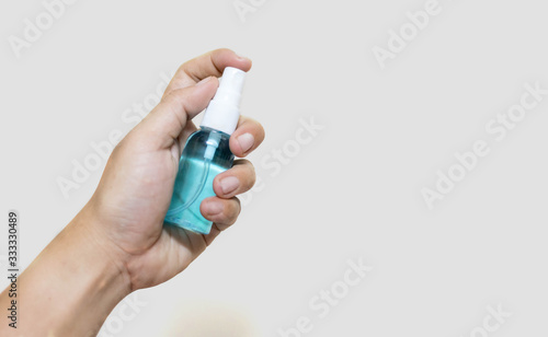 Woman hand holding alcohol sprey bottle for hygiene coronavirus (COVID-19)