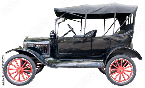 Vintage antique automobile isolated against a white background
