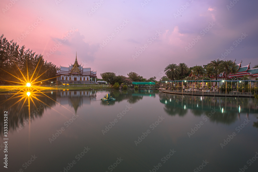 Obraz premium Wallpaper Wat Lan Boon Mahawihan Somdet Phra Buddhacharn(Wat Non Kum)is the beauty of the church that reflects the surface of the water, popular tourists come to make merit and take a public photo