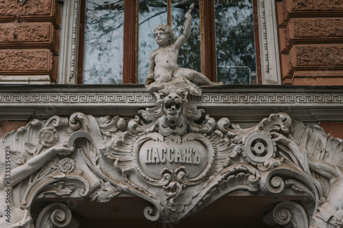 Entrance to the 19th century shopping center with the inscription * passage * with beautiful bas-reliefs