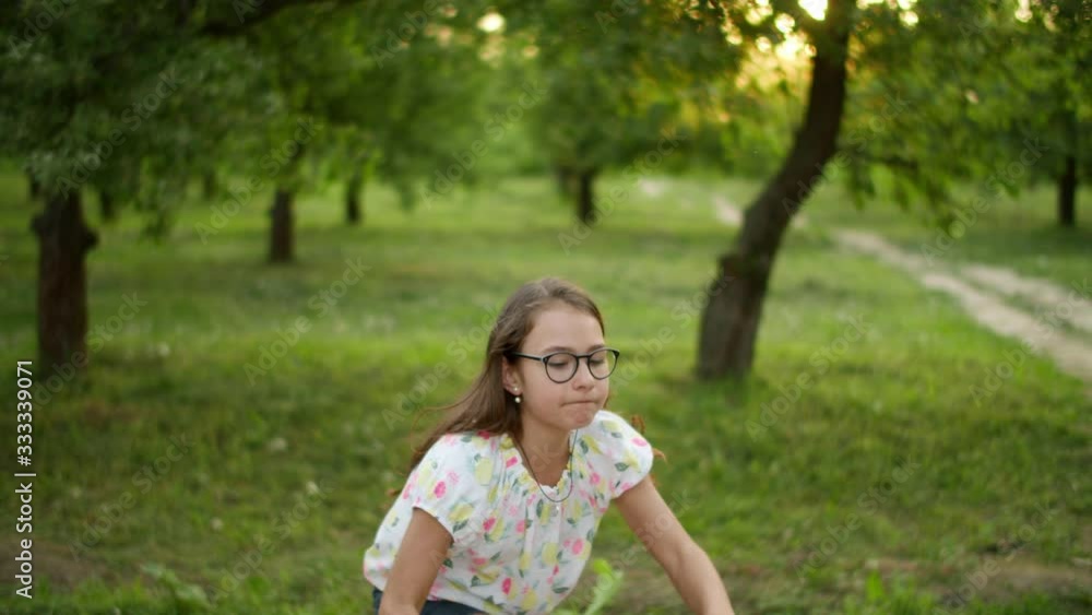 Happy girl making having fun outdoors. Teenage girl dancing outside. Happy girl making having fun outdoors. Teenage girl dancing outside.