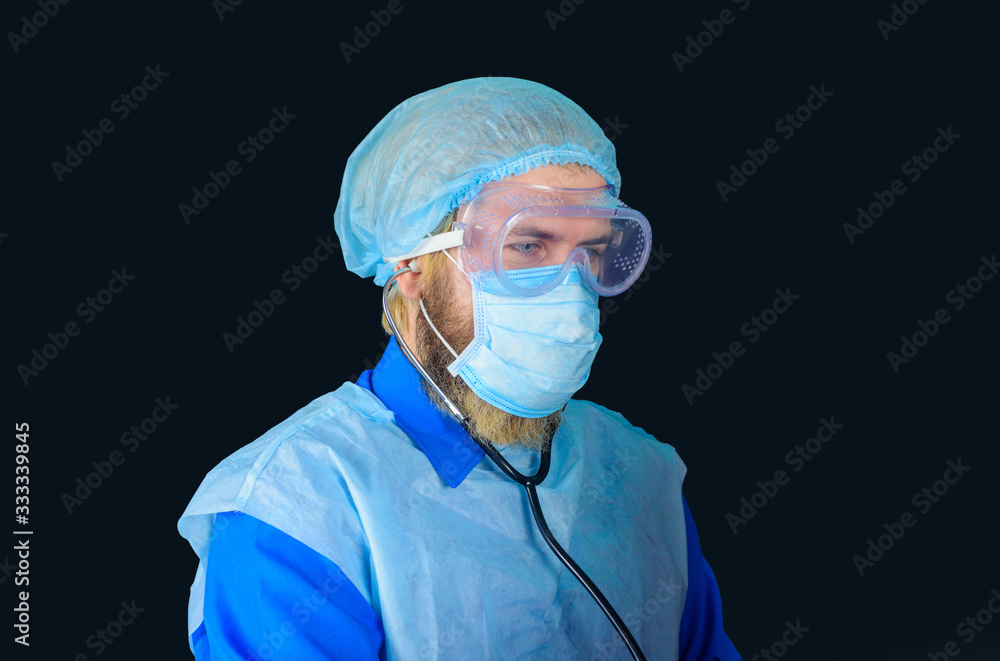 Handsome doctor in medical uniform with stethoscope. Medical physician doctor man. Man doctor in protective suit and medical mask. Healthcare, profession and medicine concept. Doctor with stethoscope. Handsome doctor in medical uniform with stethoscope. Medical physician doctor man. Man doctor in protective suit and medical mask. Healthcare, profession and medicine concept. Doctor with stethoscope.