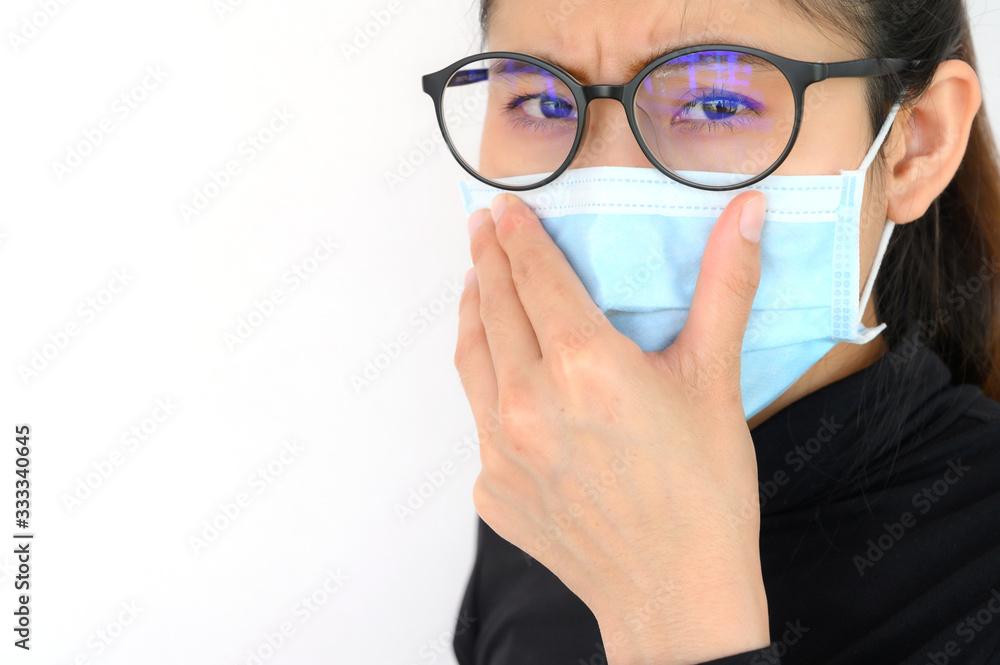 Shot of young Asian woman worring and wearing mask for protect bad air pollution or virus. Air pollution has been associated with diseases of the heart and lungs, cancers and other health problems. Shot of young Asian woman worring and wearing mask for protect bad air pollution or virus. Air pollution has been associated with diseases of the heart and lungs, cancers and other health problems.