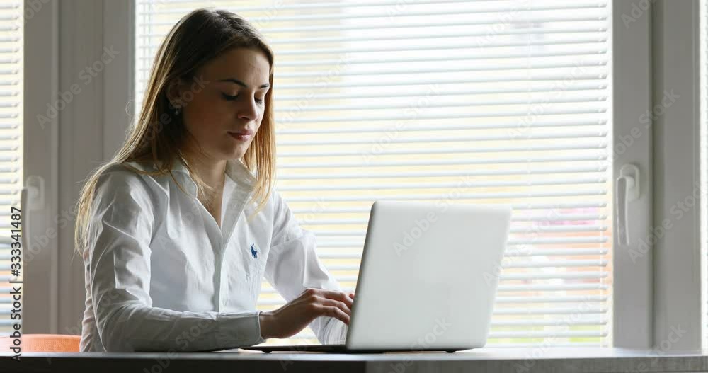 unresponsive laptop computer of a young woman unresponsive laptop computer of a young woman