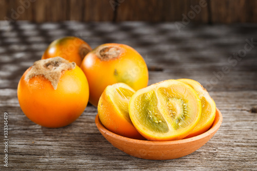 Fruit of lulo or naranjilla on wood photo