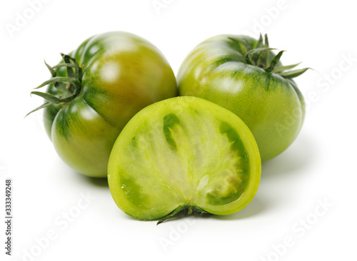 fresh green tomato isolated on white background