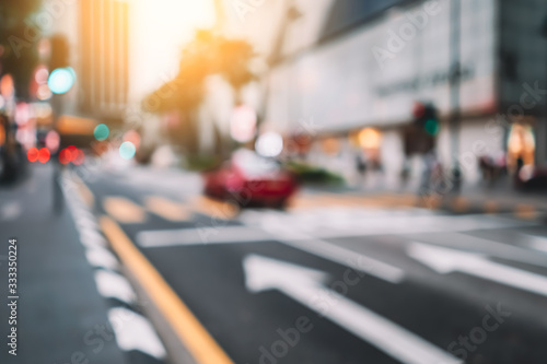 Blur traffic road with colorful bokeh light abstract background.