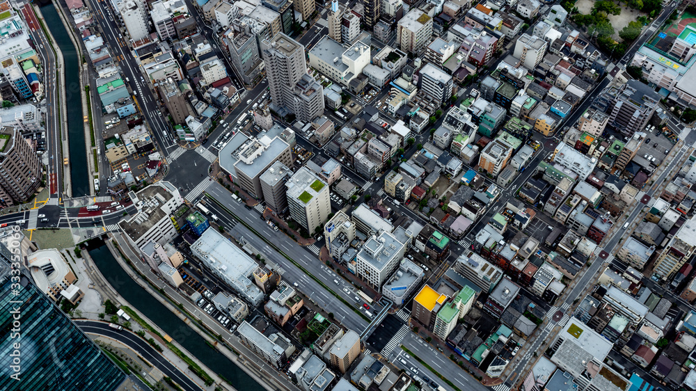Urban Metropolitan Cityscape in Tokyo, Japan with busy skyline and dense vibrant buildings 