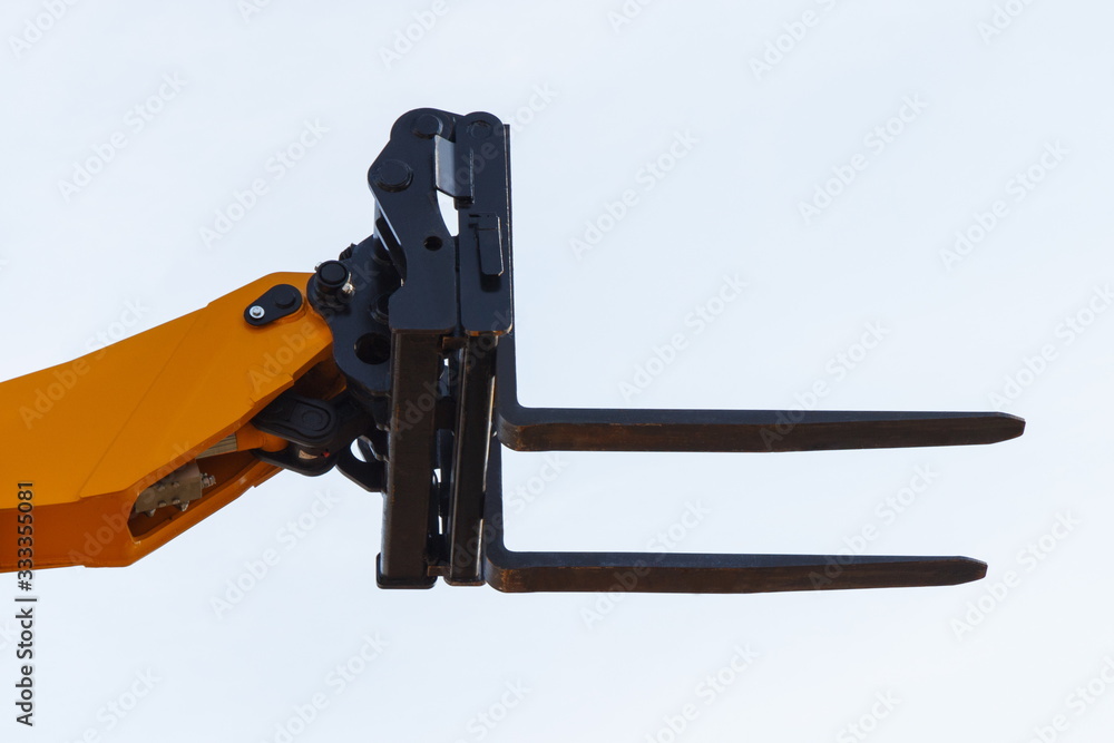 Part of forklift loader or stacker. Modern technology in industry or agriculture concept Part of forklift loader or stacker. Modern technology in industry or agriculture concept