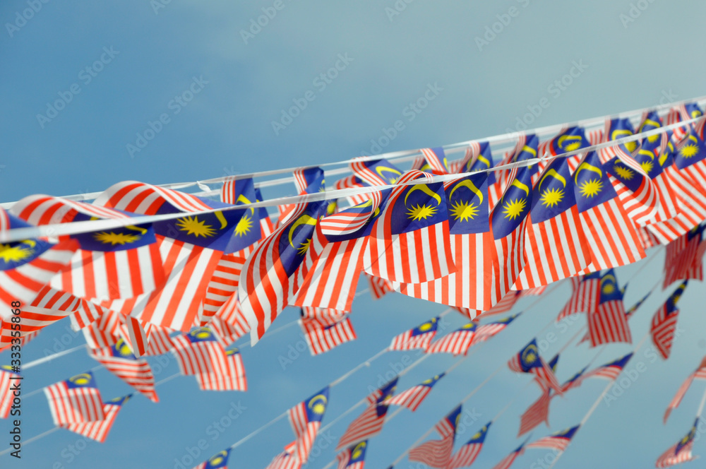 selective-focused-on-small-size-malaysian-flags-tied-together-in-large