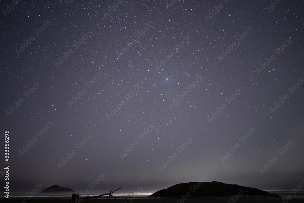 Fototapeta premium ..The stars, the islands, and the sea at night near Tofino BC..