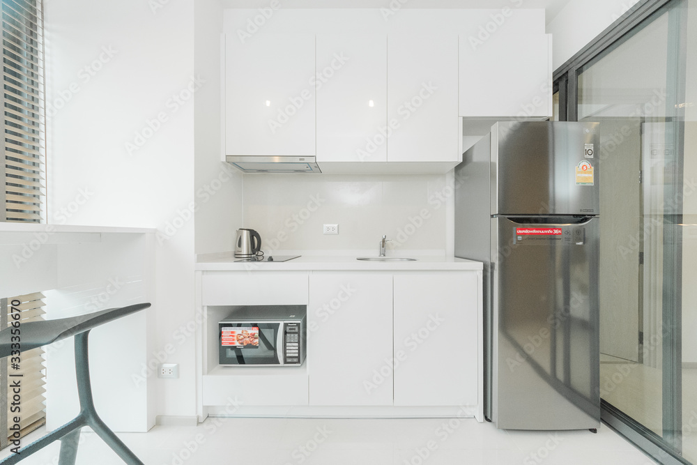 Stylish kitchen interior with dining table and chairs Stylish kitchen interior with dining table and chairs