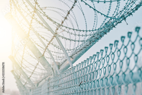 Border fence with barbed wire. Closing for quarantine. Maximum Security Detention Facility. © Konstantin Savusia