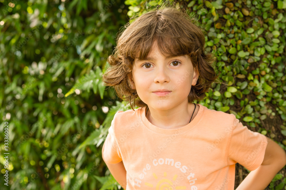 Little Boy walking in the park on a summer day Little Boy walking in the park on a summer day