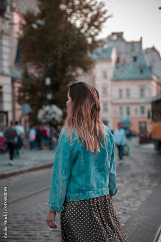 beautiful girl is walking in the city