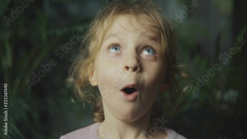The little girl is surprised. face close-up.