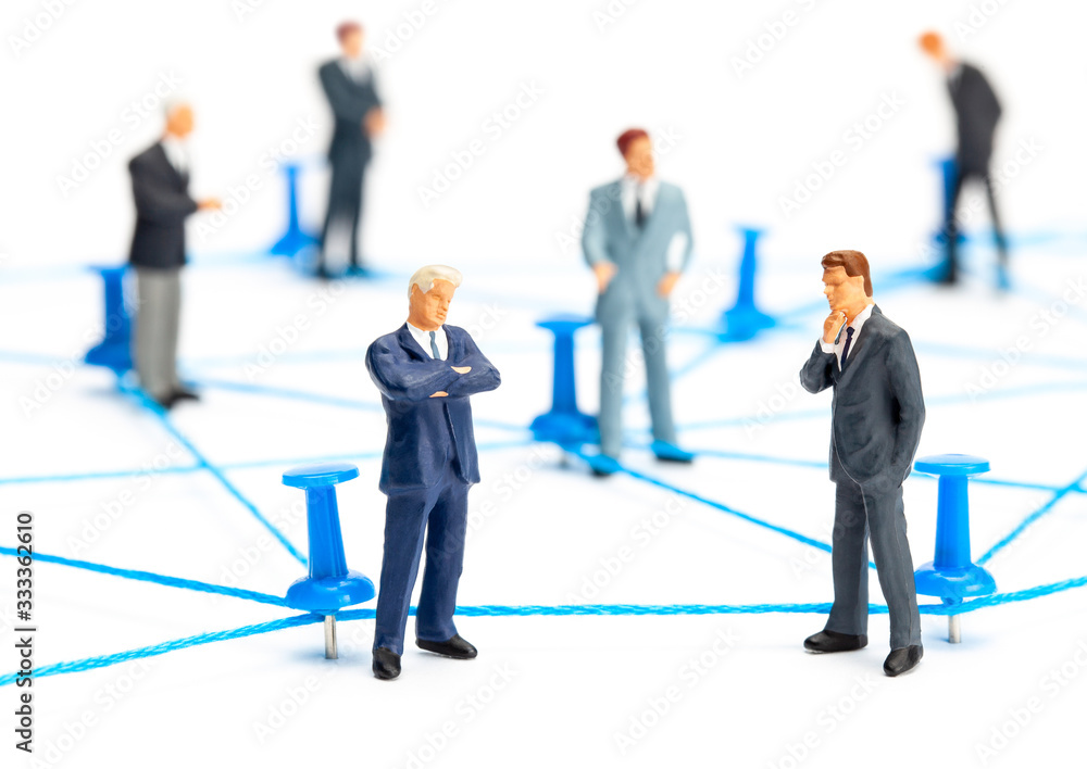 Business connection. Communication between businessmen. Network of threads and office pins. Isolated on  white background