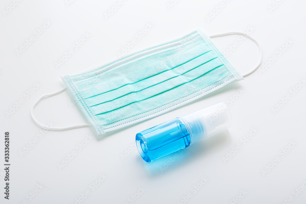 Covid-19 protection mask and alcohol bottle Covid-19 protection mask and alcohol bottle